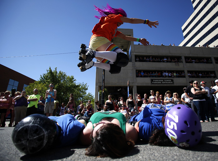 Roller skaters perform during a gay pride parade in Salt Lake City, Utah, June 2, 2013. Both active Mormons and members of the Boy Scouts marched with members of LGBT community and their supporters as part of the Utah Pride Festival. REUTERS/Jim Urquhart (UNITED STATES)